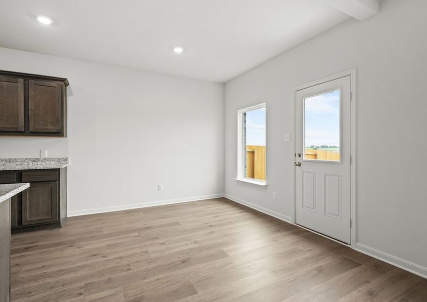The dining room has a large window that lets in great, natural light.
