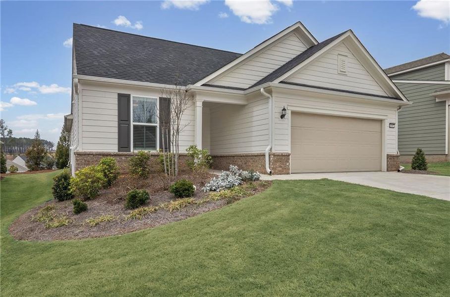Front exterior of a new home in Sun City Peachtree, Griffin, GA, highlighting curb appeal (Image 22).