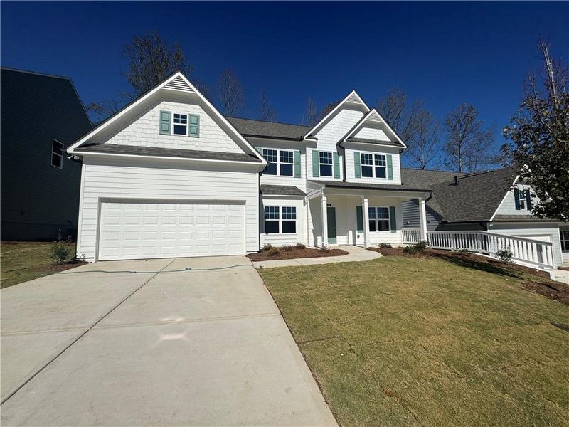 Front exterior of a new home in The Reserve at Willow Oaks, Canton, GA, highlighting curb appeal (Image 2). Front exterior of a new home in The Reserve at Willow Oaks, Canton, GA, highlighting curb appeal (Image 2).
