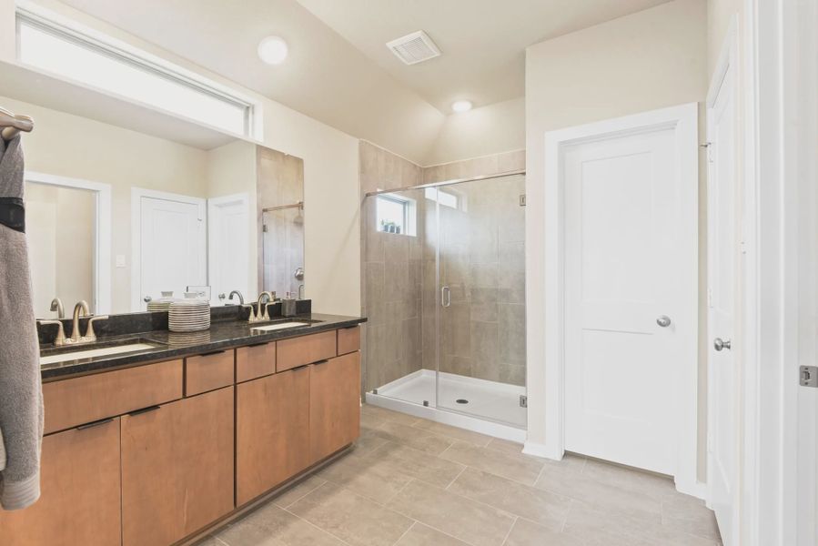 Representative furnished interior of a home built from the Fairview by Chesmar Homes in Sienna Courtyard, Missouri City (Image 12).