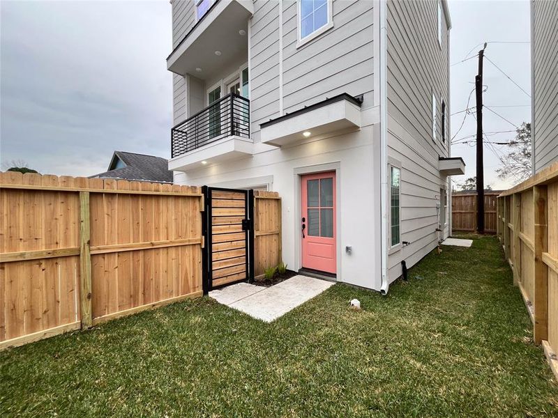 Welcoming front entrance with a private, fenced yard.