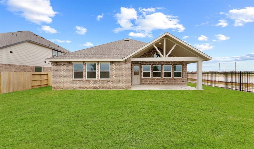 Spacious backyard and back patio with gabled roof. (*Photo not of actual home and used for illustration purposes only.)