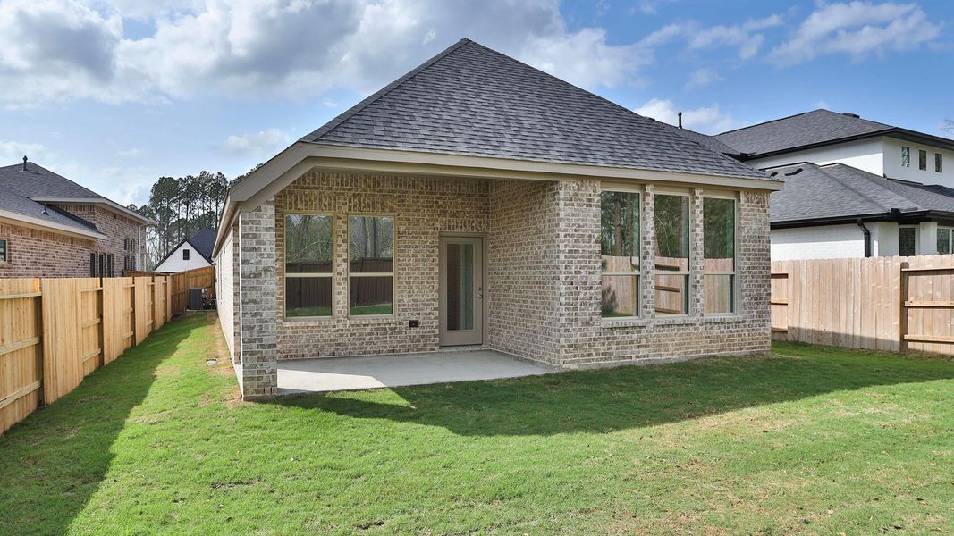 Exterior details and patio area of a home in Woodhavyn, Magnolia (Image 3).