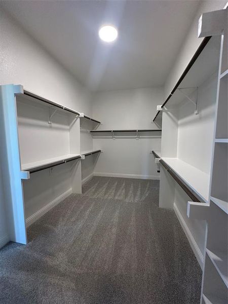 PrimaPrimary closet conveniently connects to the utility roomry closet
