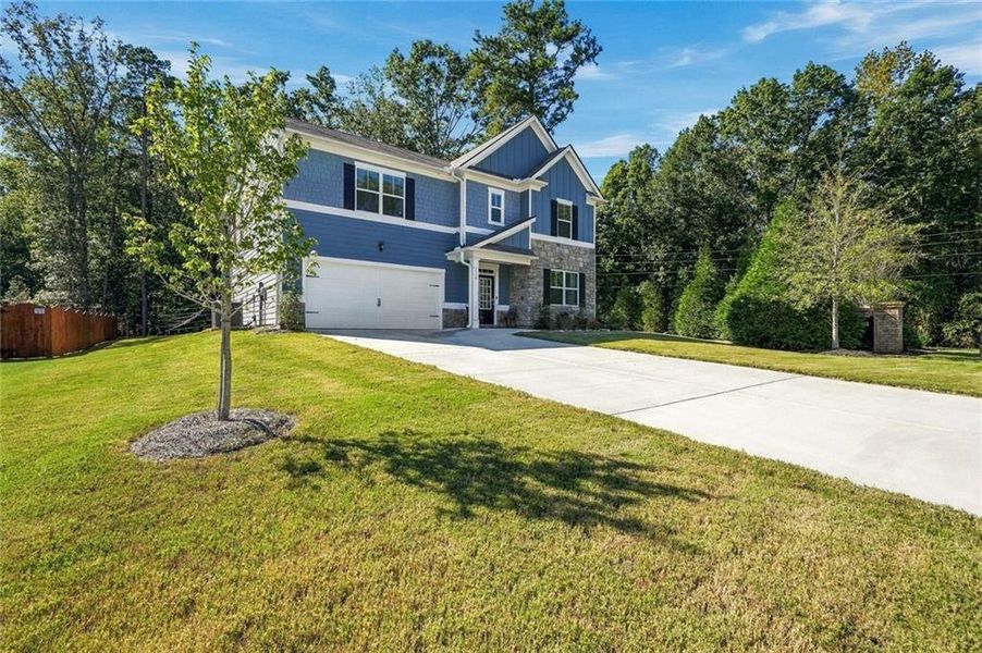 Front exterior of a new home in , Braselton, GA, highlighting curb appeal (Image 21). Front exterior of a new home in , Braselton, GA, highlighting curb appeal (Image 21).