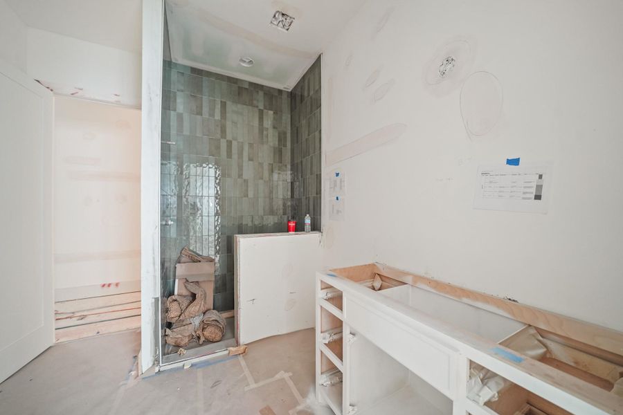 A beautiful hall bath serves both the bedroom and the game room!