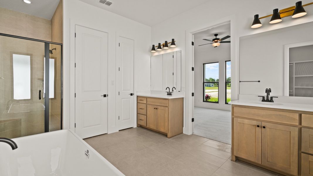 Furnished interior view inside a new home in Glynlea Country Club, Port St. Lucie (Image 8).
