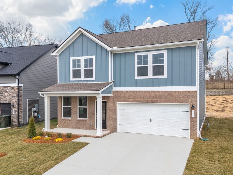 Front exterior of a new home in Woods Crossing, Gallatin, TN, highlighting curb appeal (Image 23).