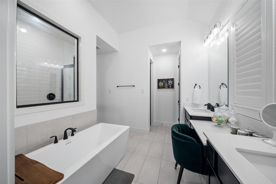 Luxurious Primary Bath with separate spa like tub and shower. Double Sink and Vanity.