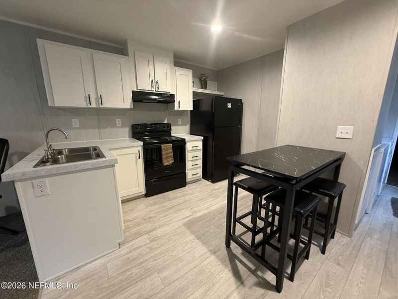 Furnished interior view inside a new home in , Florahome (Image 7).