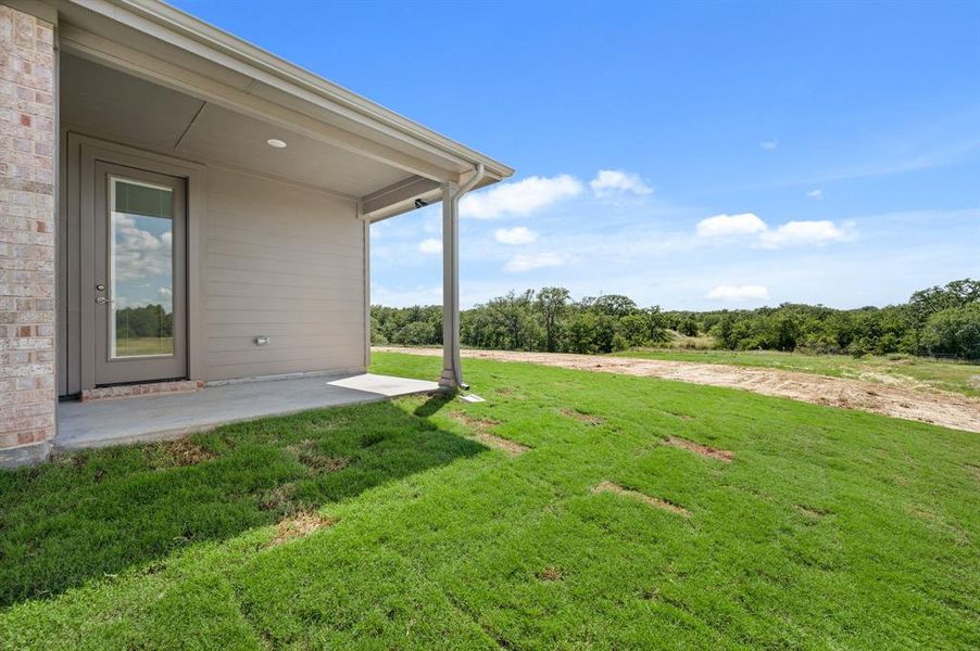 Front exterior of a new home in Saddleback Estates, Boyd, TX, highlighting curb appeal (Image 1). Front exterior of a new home in Saddleback Estates, Boyd, TX, highlighting curb appeal (Image 1).