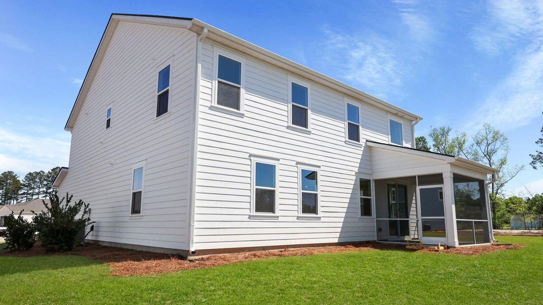 Front exterior of a new home in Berkeley Bay, Ridgeville, SC, highlighting curb appeal (Image 1).