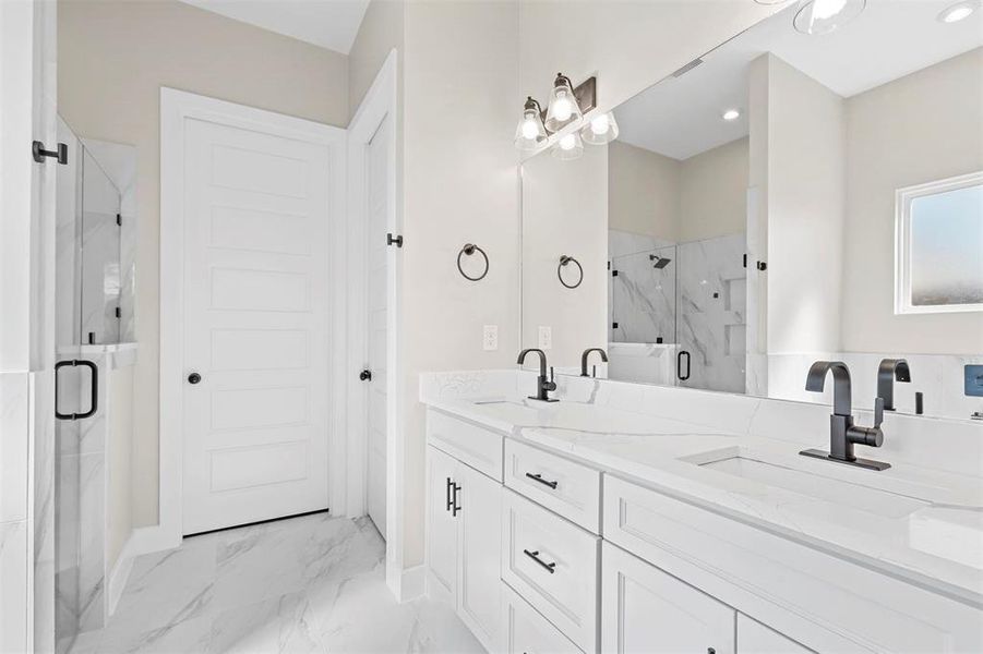 Bathroom with vanity and an enclosed shower