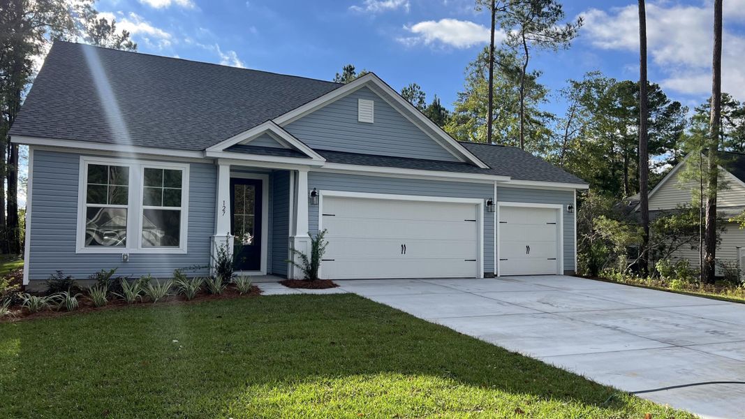 Front exterior of a new home in Dorchester County Homes, Summerville, SC, highlighting curb appeal (Image 1).