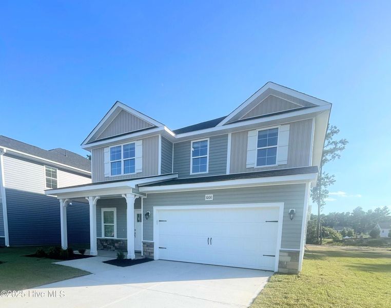 Front exterior of a new home in Athens Acres, New Bern, NC, highlighting curb appeal (Image 2).