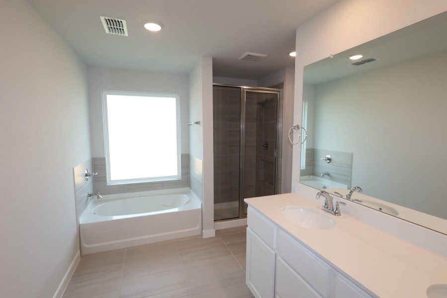 Furnished interior view inside a new home in The Cove at Mason Woods, Cypress (Image 9).