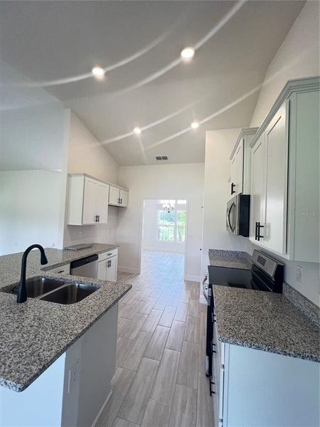 Furnished interior view inside a new home in Hill Country Estates, Dade City (Image 4).