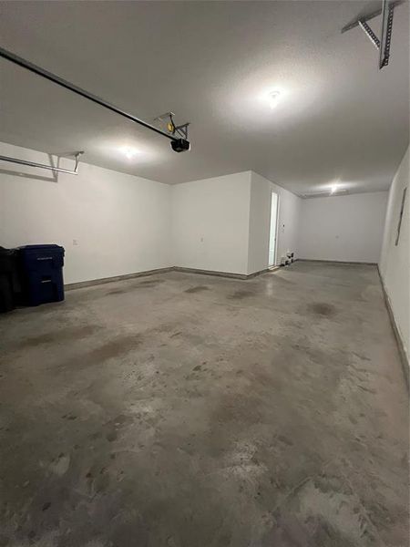 Garage featuring baseboards Garage featuring baseboards