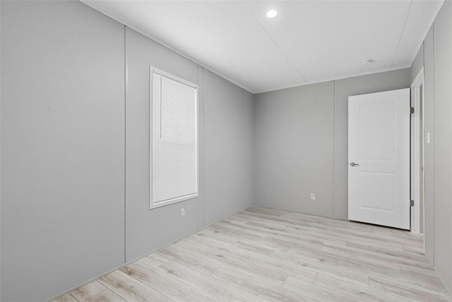 Spare room with light wood-style floors and recessed lighting Spare room with light wood-style floors and recessed lighting
