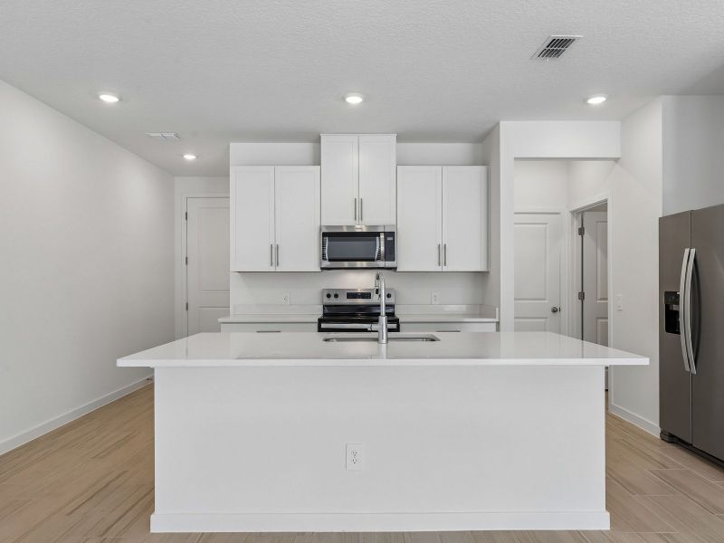 Furnished interior view inside a new home in The District at Oakleaf - The Grove, Middleburg (Image 4).