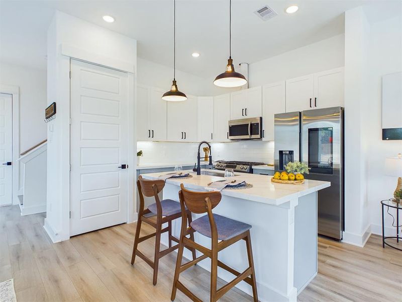 MOVE-IN READY! High-end interior finishes including quartz countertops, big kitchen island, stainless-steel appliances, upgraded cabinets with soft close drawers. FINISHES & FLOOR PLANS WILL VARY! Ceiling fans are not included!