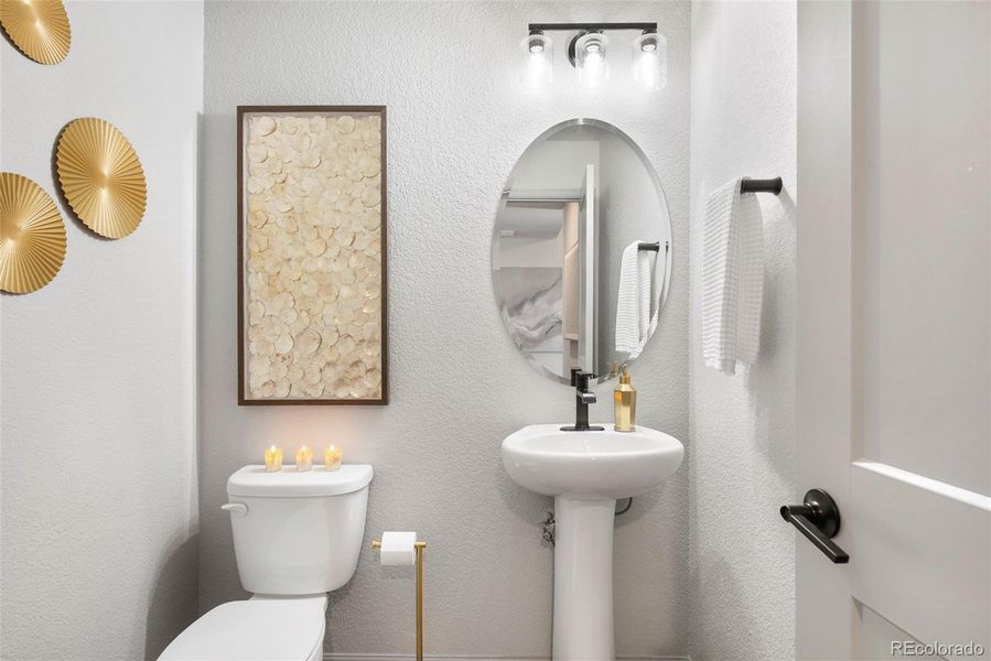 Powder room ideally located in its own private hall.