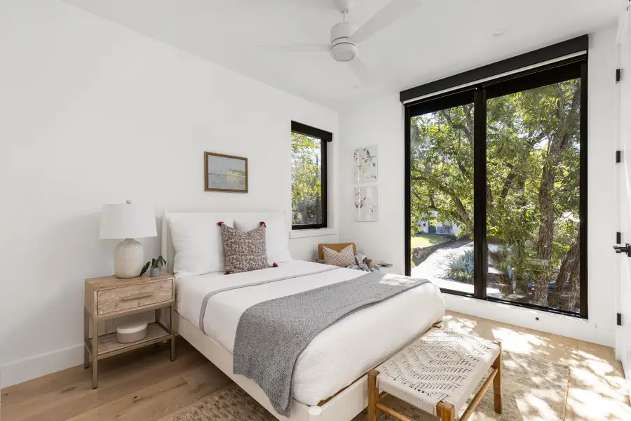 Bedroom with wood finished floors and a ceiling fan Bedroom with wood finished floors and a ceiling fan