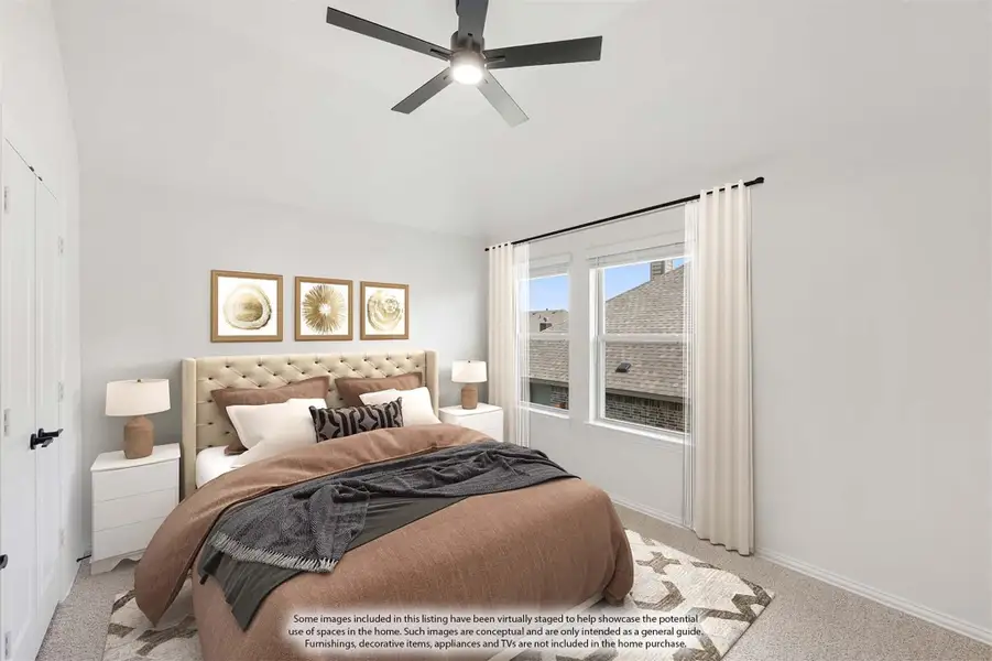 Bedroom with tufted headboard, ceiling fan, carpet flooring, and large window with white curtains