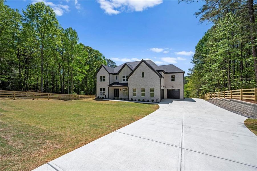 Front exterior of a new home in , Lawrenceville, GA, highlighting curb appeal (Image 25).