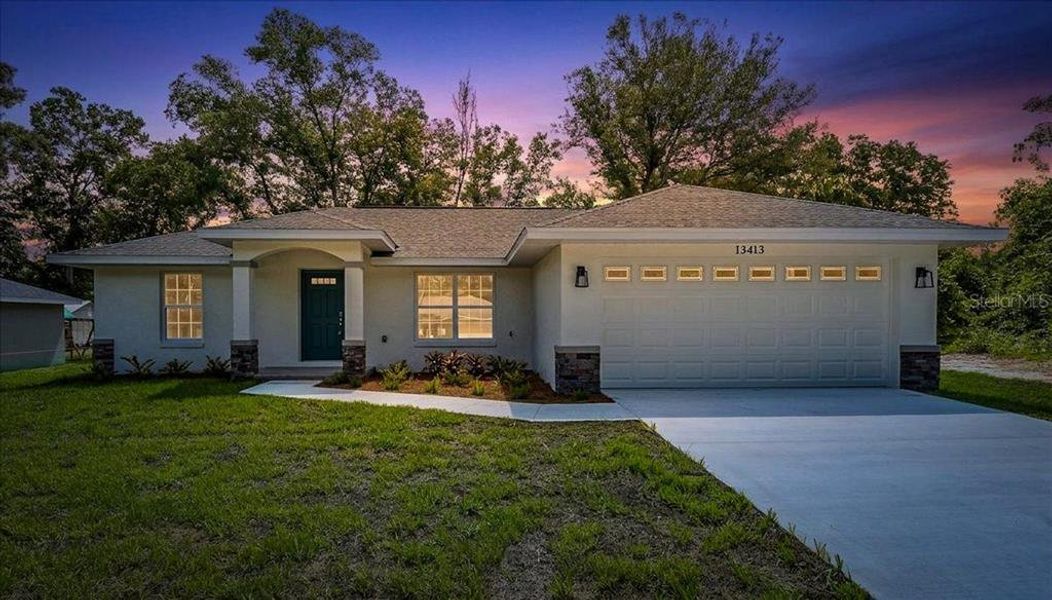Front exterior of a new home in , Belleview, FL, highlighting curb appeal (Image 16).