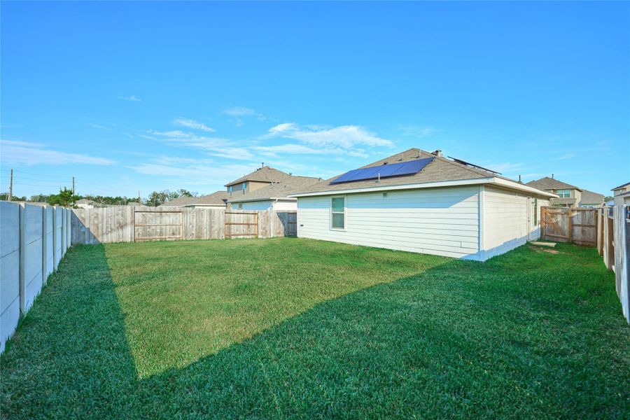 Exterior details and patio area of a home in Tavola: Cottage Collection, New Caney (Image 23).