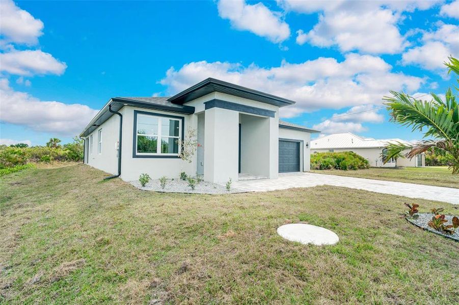 Front exterior of a new home in , Rotonda West, FL, highlighting curb appeal (Image 31).
