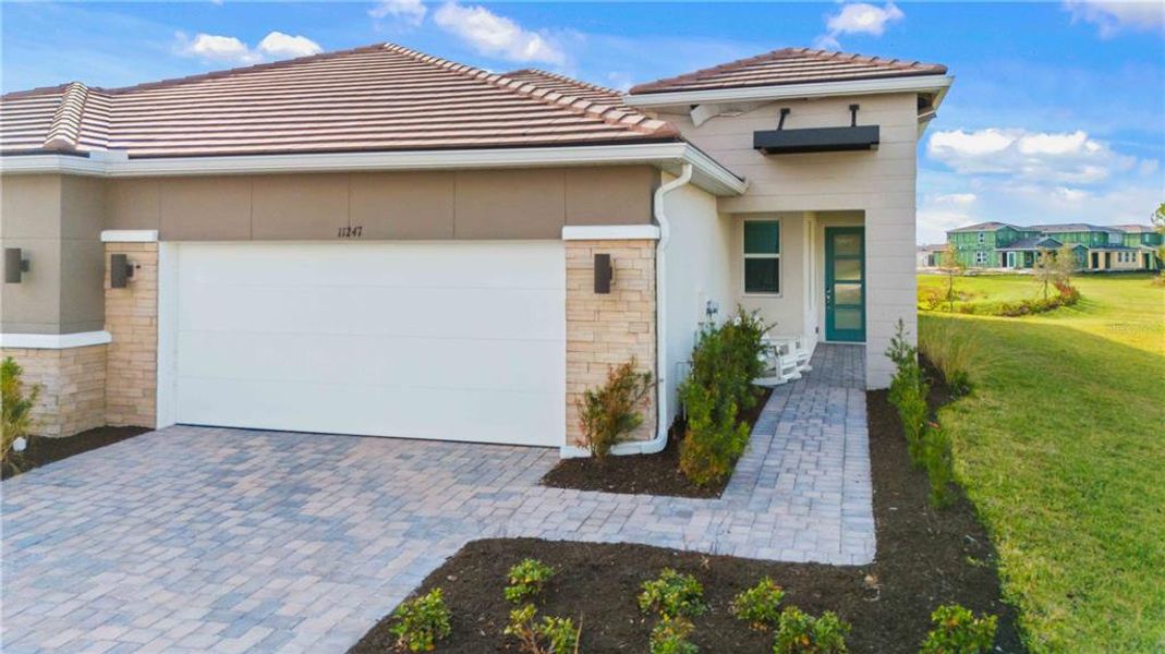 Front exterior of a new home in , Venice, FL, highlighting curb appeal (Image 2). Front exterior of a new home in , Venice, FL, highlighting curb appeal (Image 2).