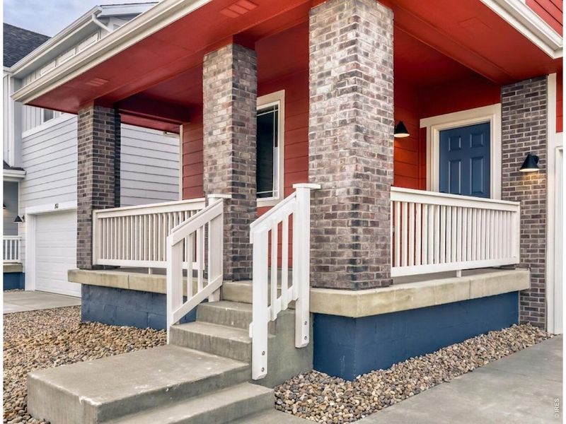 Exterior details and patio area of a home in Farmstead, Berthoud (Image 19).