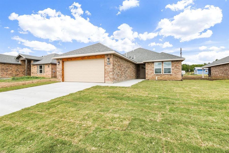 Front exterior of a new home in , Coleman, TX, highlighting curb appeal (Image 15).