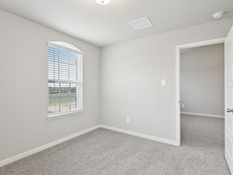 Guest bedroom in the San Jacinto floorplan at a Meritage Homes community.