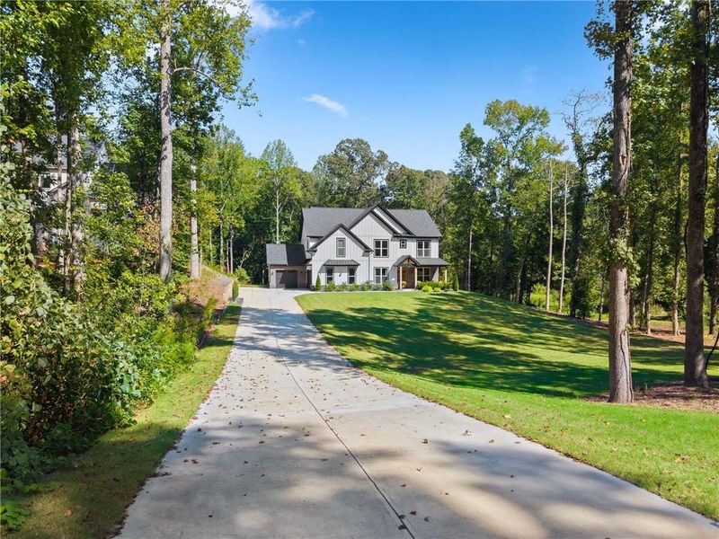 Front exterior of a new home in , Hoschton, GA, highlighting curb appeal (Image 20). Front exterior of a new home in , Hoschton, GA, highlighting curb appeal (Image 20).