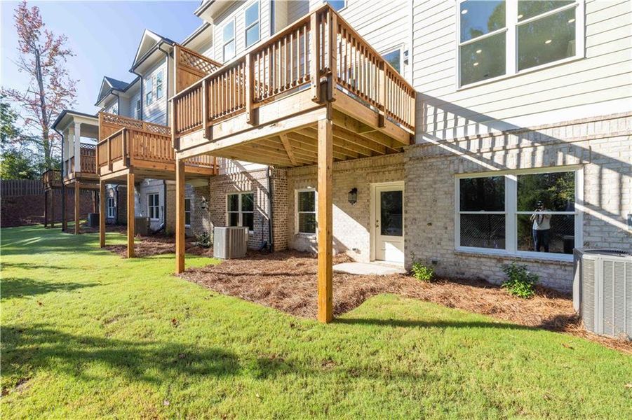 Front exterior of a new home in Evanshire Townhomes, Duluth, GA, highlighting curb appeal (Image 25).