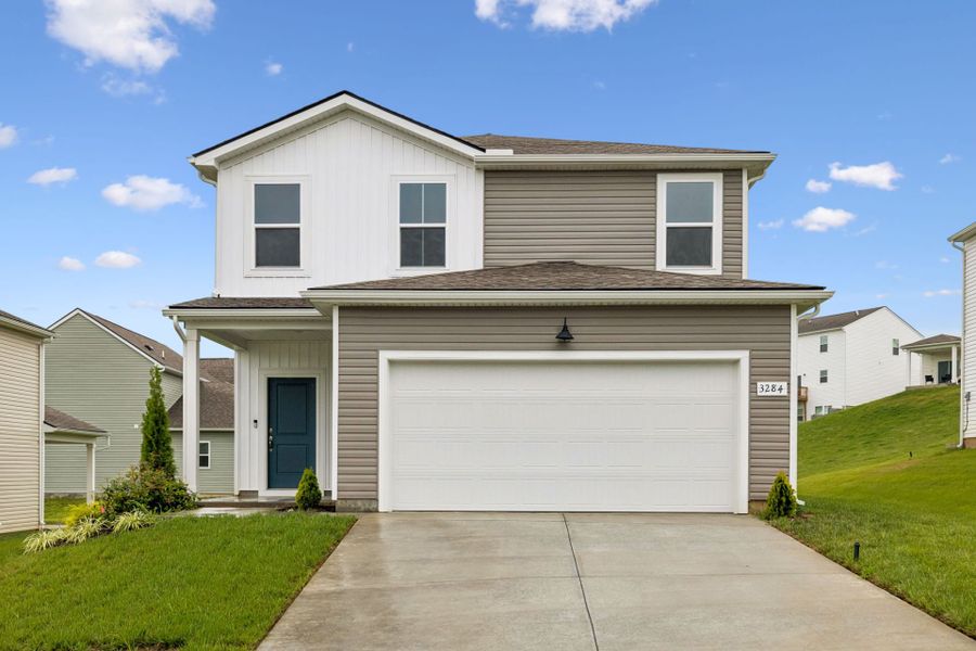 Front exterior of a new home in Highlands of Carter's Station, Columbia, TN, highlighting curb appeal (Image 22).