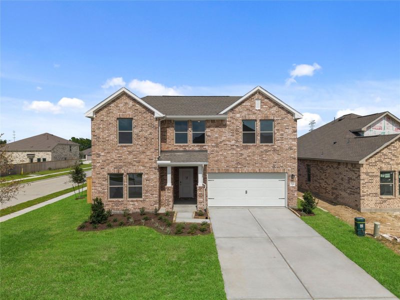 Front exterior of a new home in Windrose Green, Angleton, TX, highlighting curb appeal (Image 21). Front exterior of a new home in Windrose Green, Angleton, TX, highlighting curb appeal (Image 21).