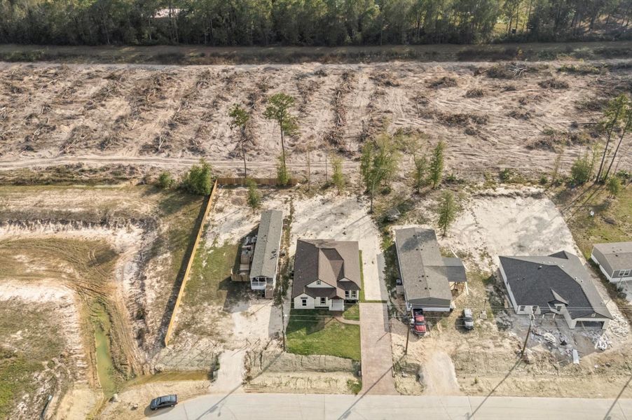 Front exterior of a new home in , Huffman, TX, highlighting curb appeal (Image 1).
