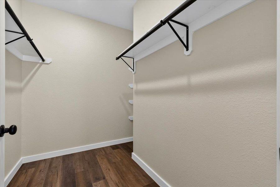 Rich wood-look flooring and built-in shelving define this functional storage space. Rich wood-look flooring and built-in shelving define this functional storage space.
