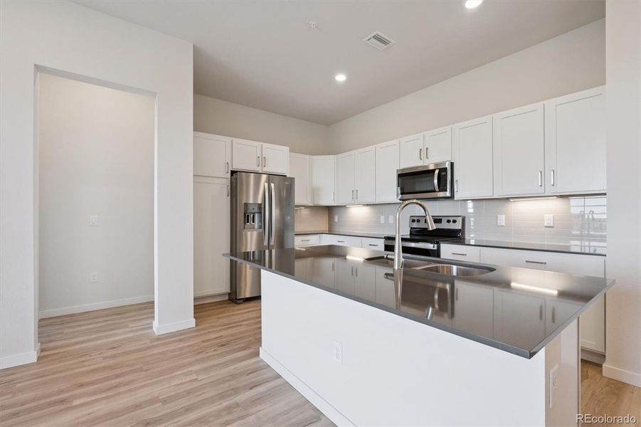 Furnished interior view inside a new home in Condo Collection at Grand Vue at Interlocken, Broomfield (Image 3).