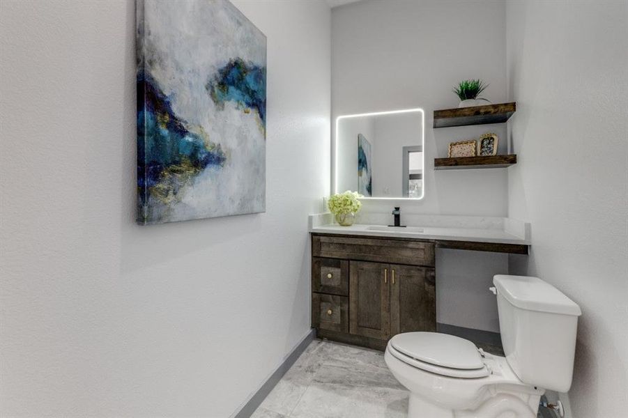 Bathroom with toilet and vanity