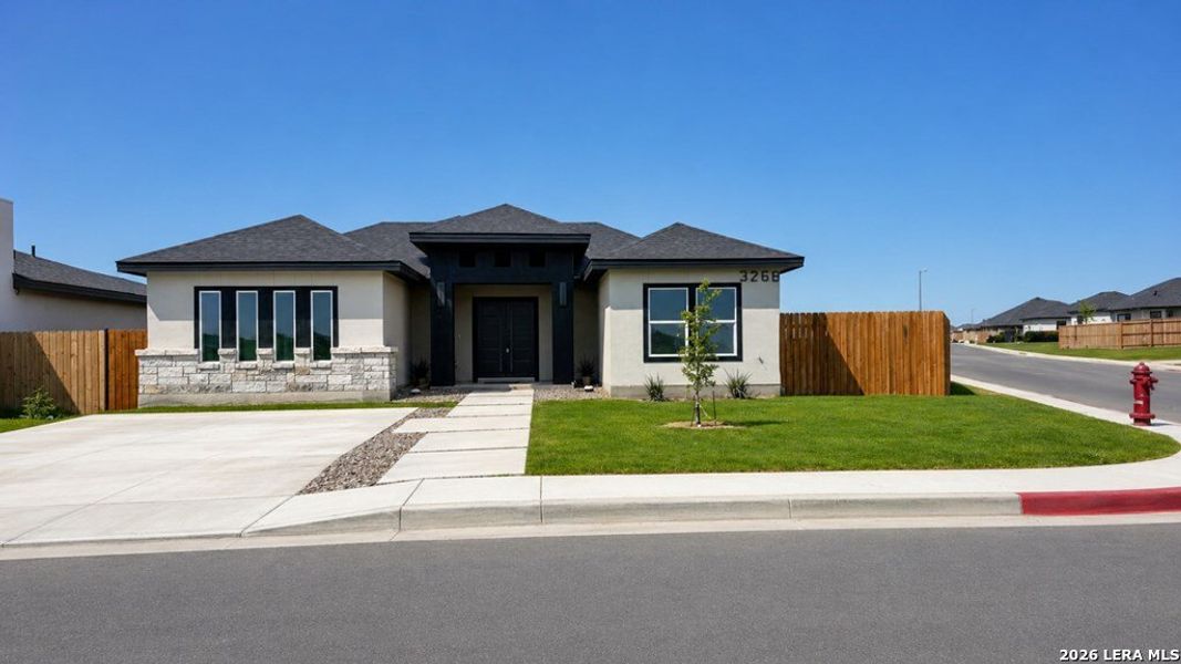 Front exterior of a new home in , Eagle Pass, TX, highlighting curb appeal (Image 1). Front exterior of a new home in , Eagle Pass, TX, highlighting curb appeal (Image 1).