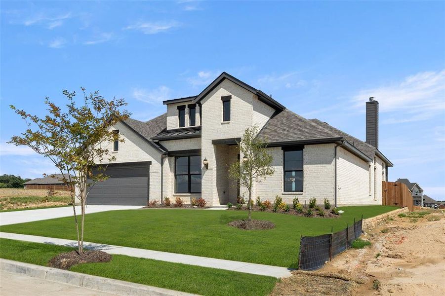 Front exterior of a new home in The Parks at Panchasarp Farms - Phase 3, Burleson, TX, highlighting curb appeal (Image 1). Front exterior of a new home in The Parks at Panchasarp Farms - Phase 3, Burleson, TX, highlighting curb appeal (Image 1).
