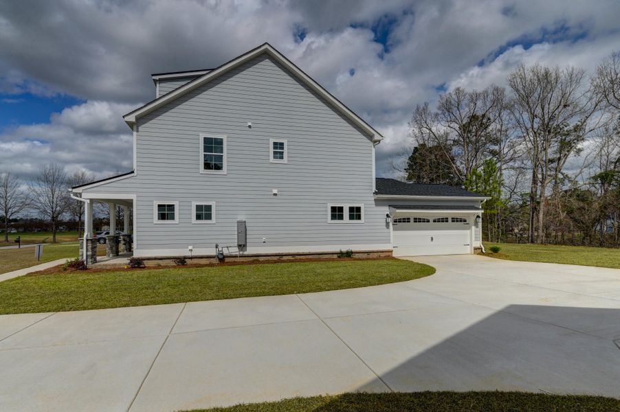Front exterior of a new home in Clubside Reserve at Summerlake, Lexington, SC, highlighting curb appeal (Image 27).