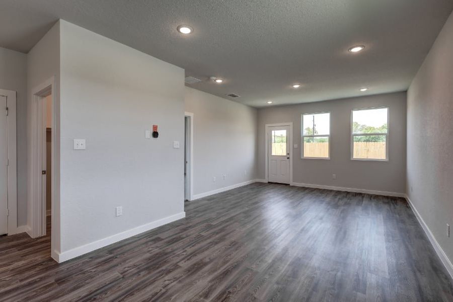 A room with white walls and a wood floor. A room with white walls and a wood floor.