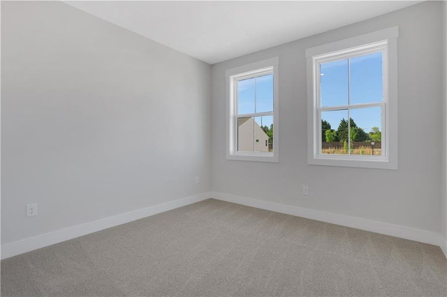 Spacious, unfurnished interior of a new home in The Paddocks at Doc Hughes, Buford (Image 22).