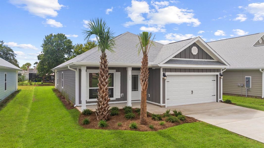 Front exterior of a new home in Caballeros Estates At Hombre, Panama City Beach, FL, highlighting curb appeal (Image 2).
